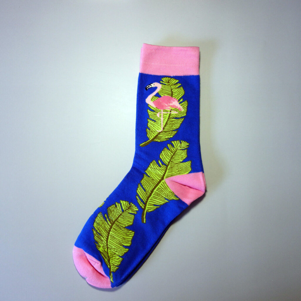 Custom sock with flamingo pattern and 3 big leaves. Base color: dark blue. Secondary colors: pink, green