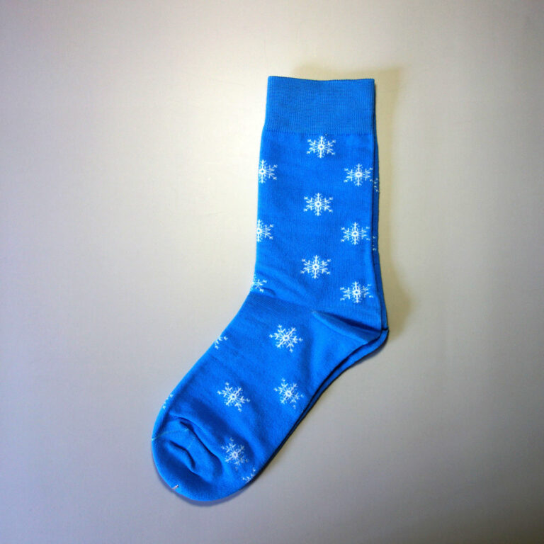 Custom made sock with snow crystals spreading on the sock. Very clean sock design. Base color: blue. Secondary color: White.