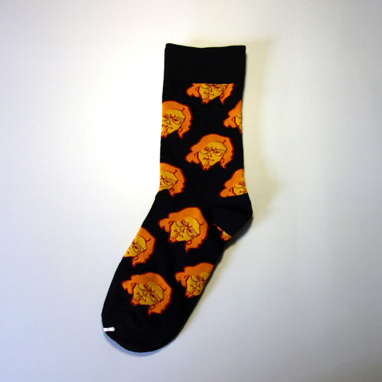 Custom knitted face sock. Base color: Black, secondary: Orange, yellow